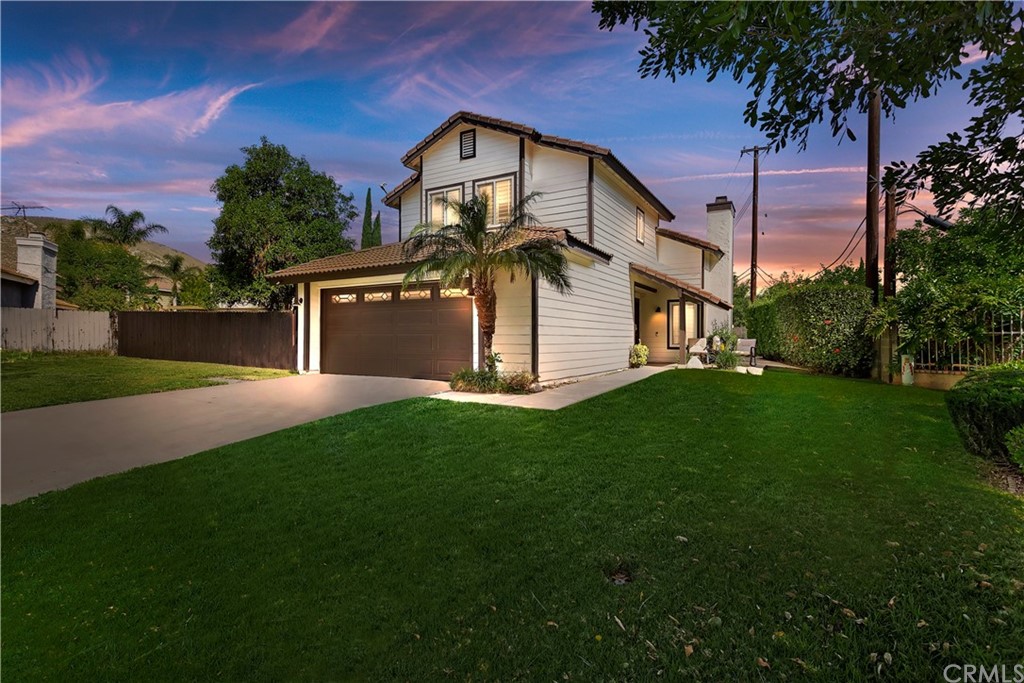 5435 Gridley Way Riverside, CA 92505 - Photo 1 of 1 a front view of a house with garden