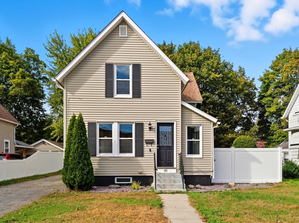 a view of a house with a yard