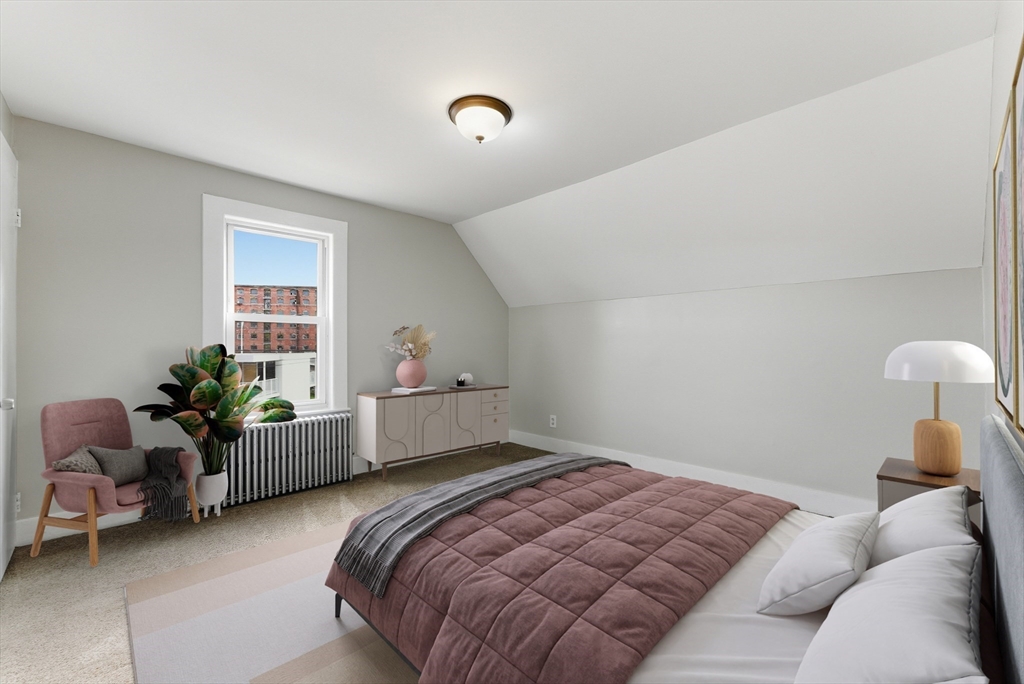 45 Meadow Street Ludlow, MA 01056 - Photo 19 of 32 a bedroom with a bed and furniture