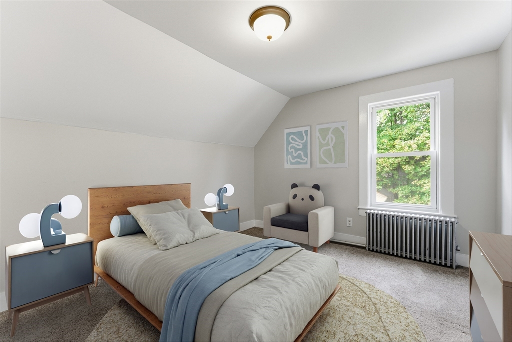 45 Meadow Street Ludlow, MA 01056 - Photo 20 of 32 a bedroom with bed and window