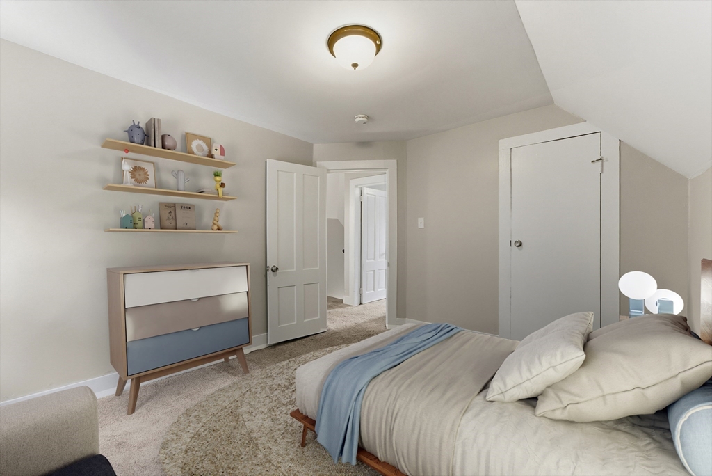 45 Meadow Street Ludlow, MA 01056 - Photo 21 of 32 a bedroom with a bed and a window