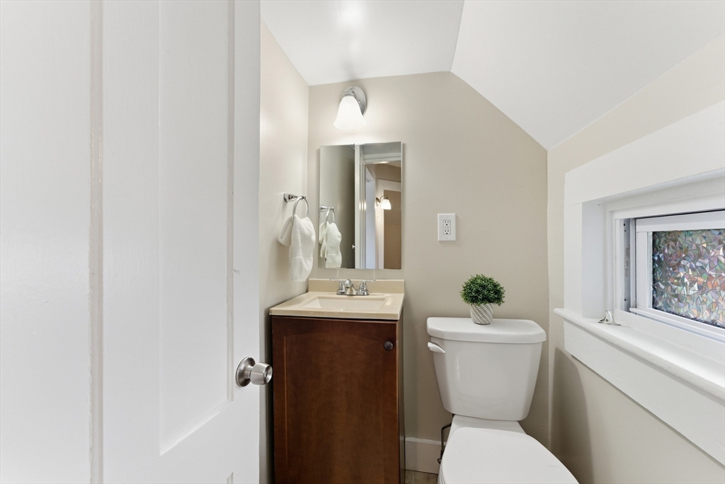 45 Meadow Street Ludlow, MA 01056 - Photo 25 of 32 a bathroom with a toilet sink and mirror