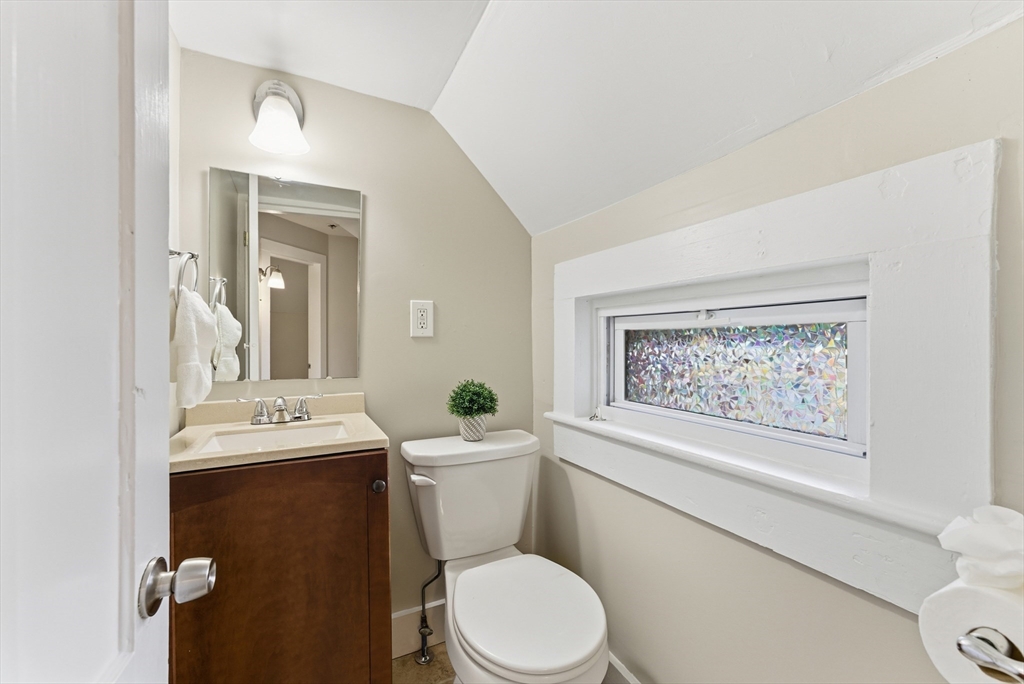 45 Meadow Street Ludlow, MA 01056 - Photo 26 of 32 a white toilet sitting next to a bathroom sink