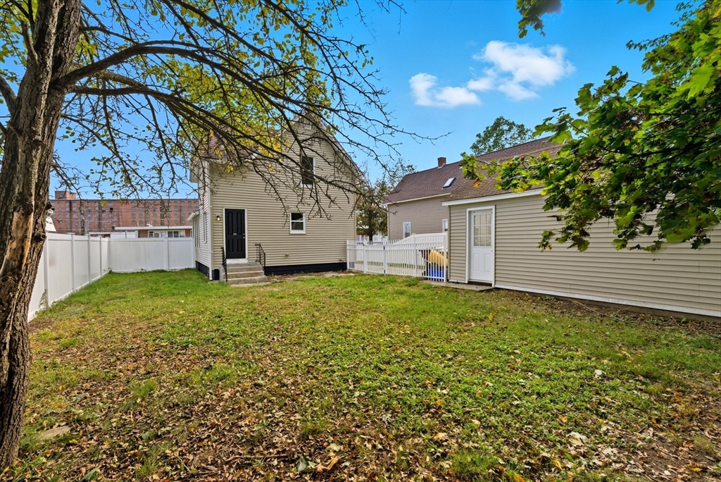 45 Meadow Street Ludlow, MA 01056 - Photo 30 of 32 a view of a backyard with a garden