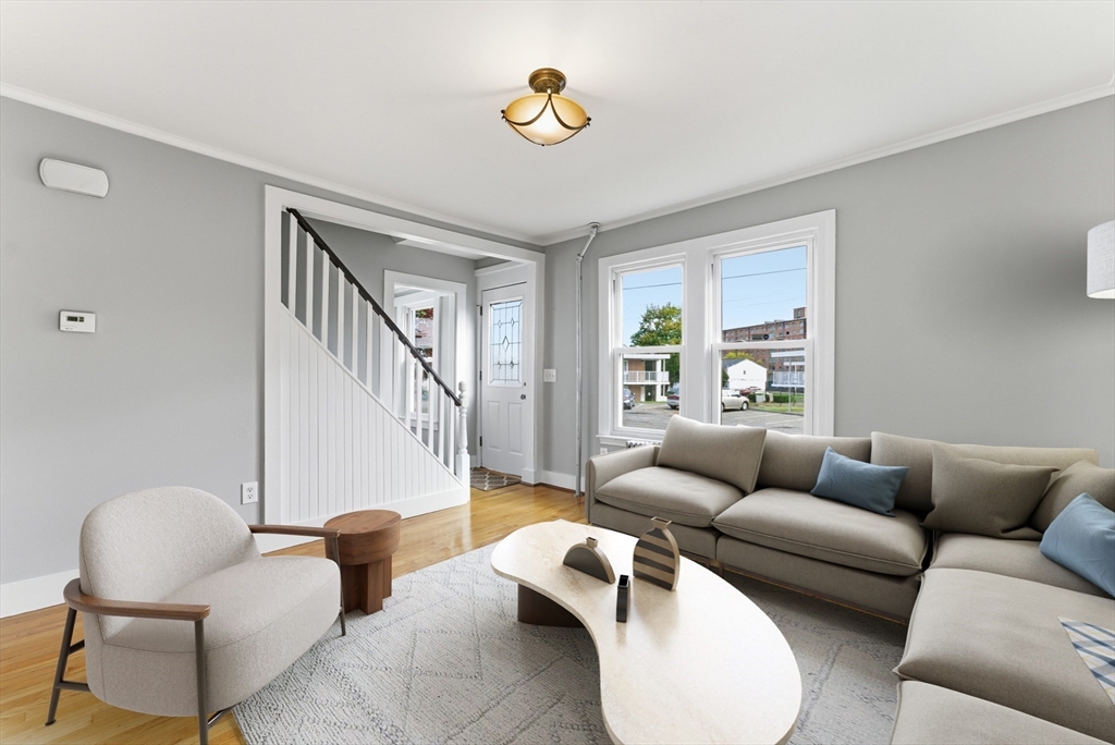 45 Meadow Street Ludlow, MA 01056 - Photo 3 of 32 a living room with furniture and a large window