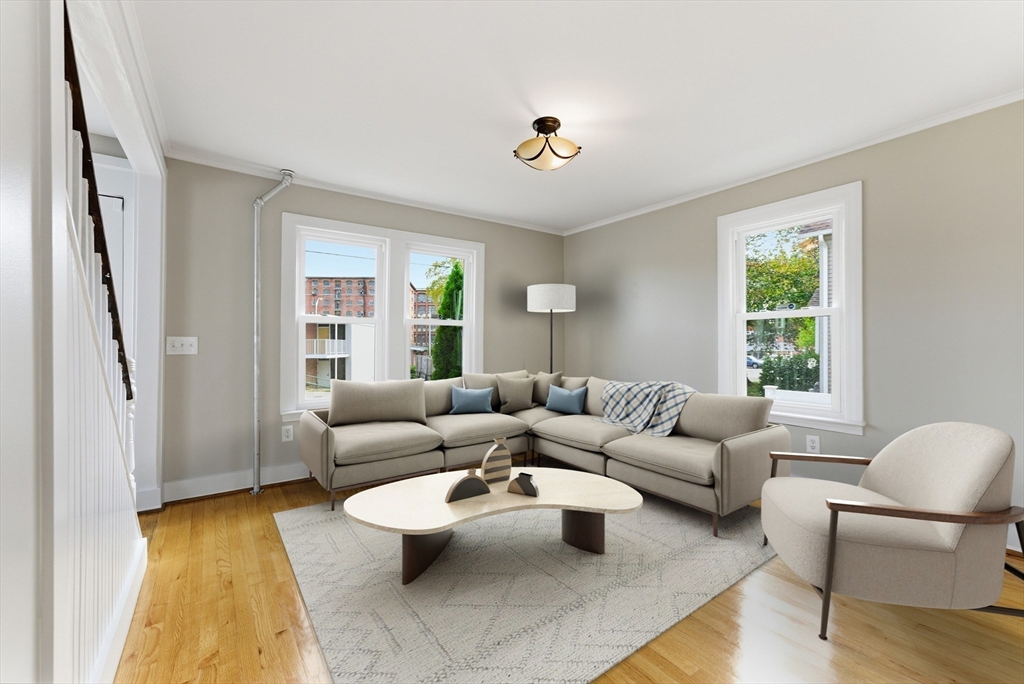 45 Meadow Street Ludlow, MA 01056 - Photo 6 of 32 a living room with furniture and a large window