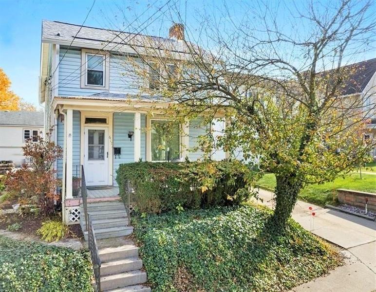 a view of a house with brick walls