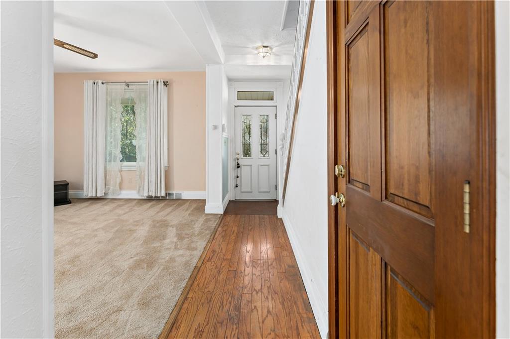 617 Maple Street Coraopolis, PA 15108 - Photo 12 of 38 a view of a hallway with wooden floor and staircase