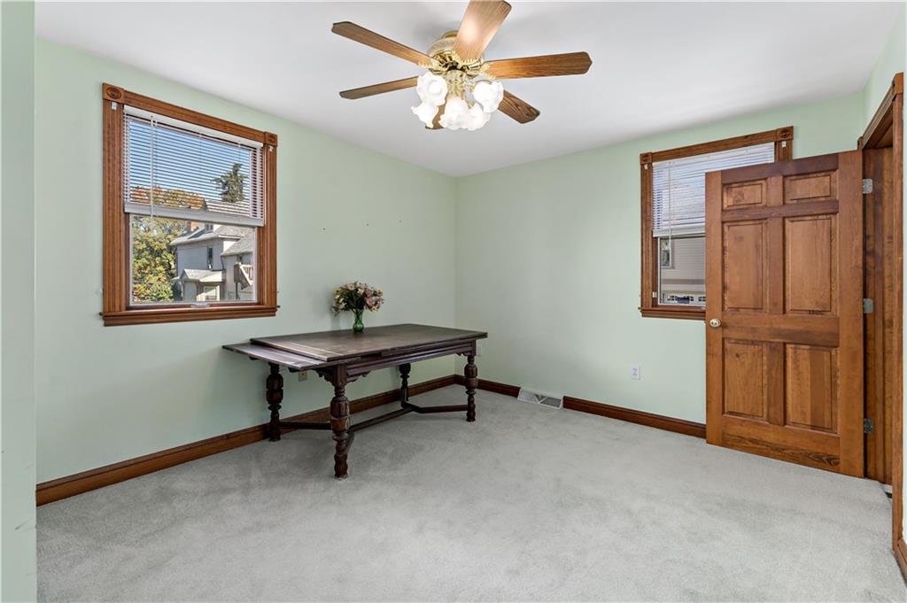 617 Maple Street Coraopolis, PA 15108 - Photo 13 of 38 a living room with furniture a window and a chandelier