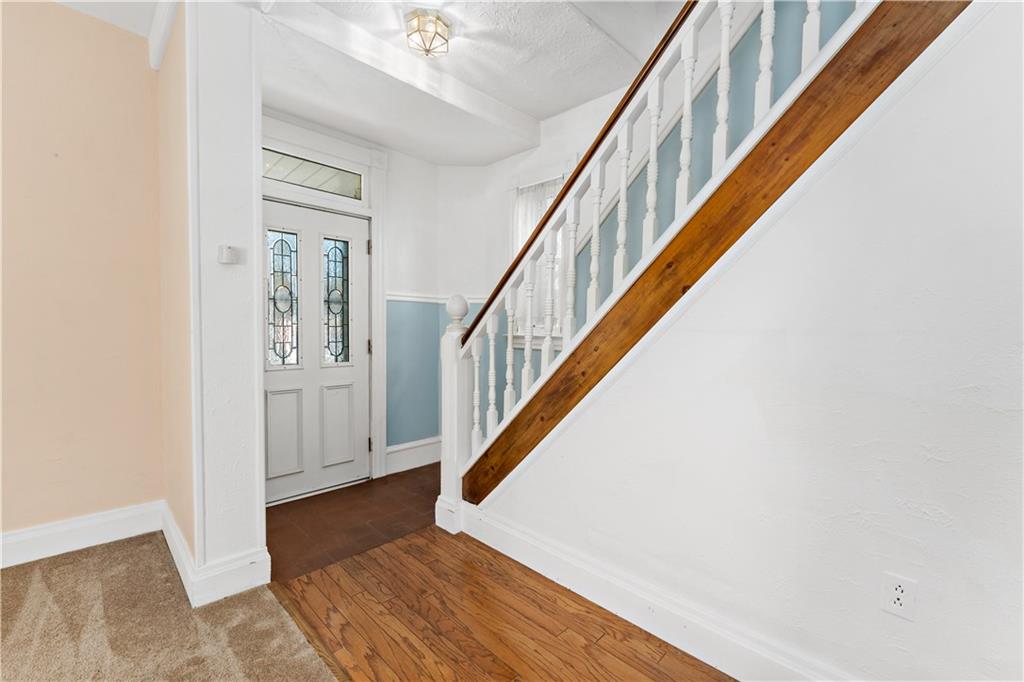 617 Maple Street Coraopolis, PA 15108 - Photo 16 of 38 a view of staircase with wooden floor and a rug