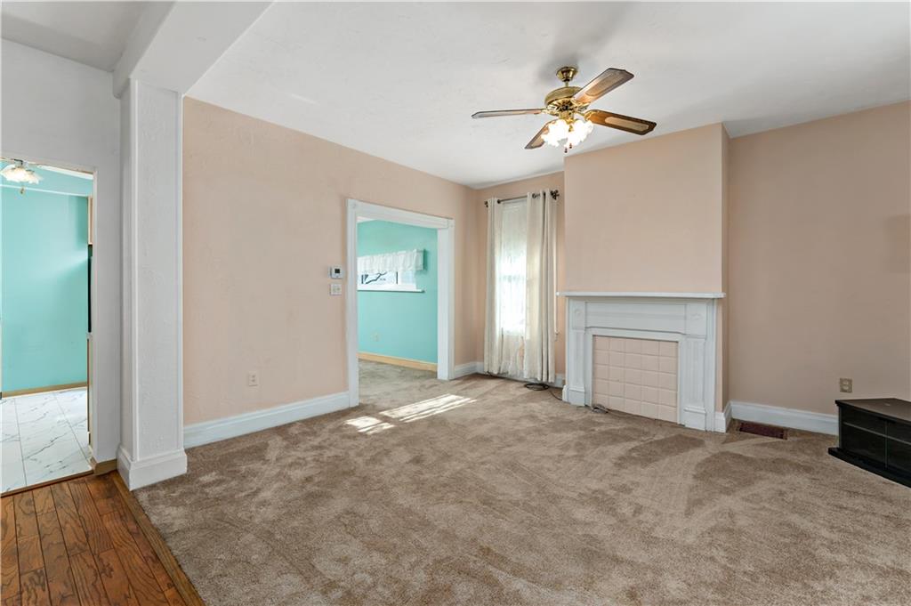 617 Maple Street Coraopolis, PA 15108 - Photo 2 of 38 an empty room with fan and windows