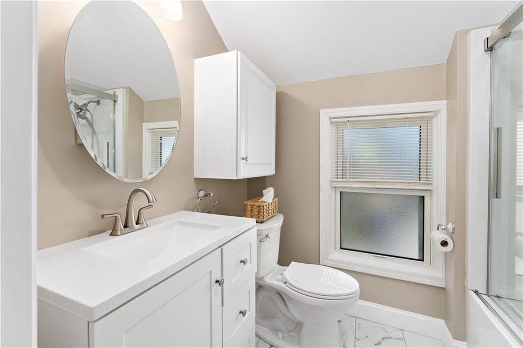 617 Maple Street Coraopolis, PA 15108 - Photo 26 of 38 a bathroom with a toilet sink and mirror