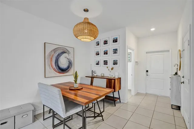 a view of a dining room that has a table and chairs in it