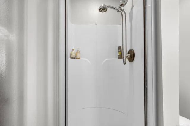 a kitchen with granite countertop a refrigerator and a sink