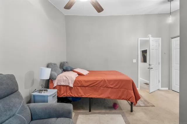a bathroom with a sink a toilet and a window