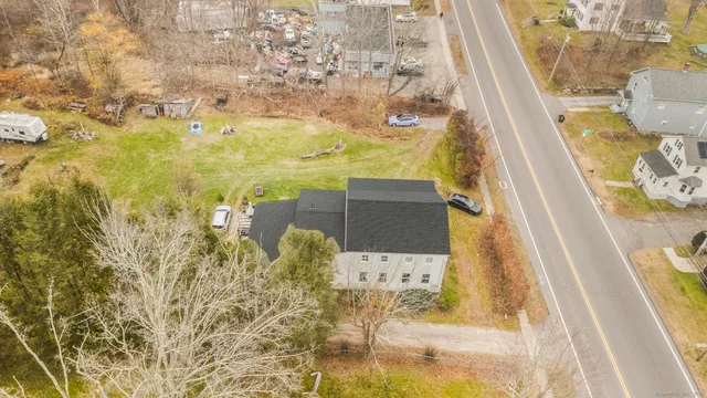 a bed room with a yard and a chair