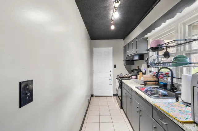 a kitchen with counter top space and appliances