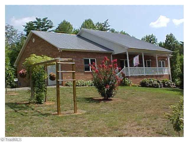 470 Old Mill Road Lowgap, NC 27024 - Photo 1 of 13 Exterior Front. Full basement is pre plumbed for full bath- lots of storage for yard equipment - 5 foot overhead door plus man door for easy access. This is really a very well built home.