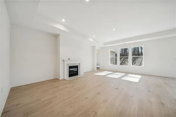 a kitchen with a sink refrigerator and cabinets
