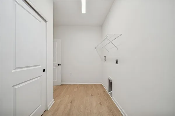 a view of an empty room with cabinet
