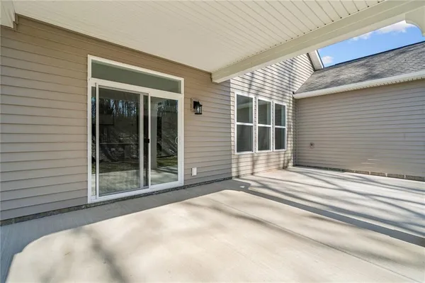a view of a room with a hardwood and door