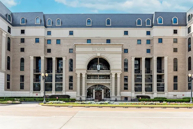 a view of building with glass windows