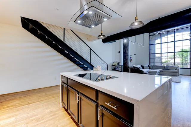 a kitchen with a sink a stove and a microwave