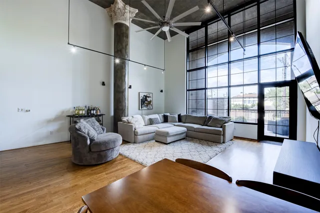 a living room with furniture rug and window