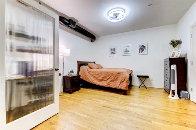 a bedroom with a bed and a view of bathroom