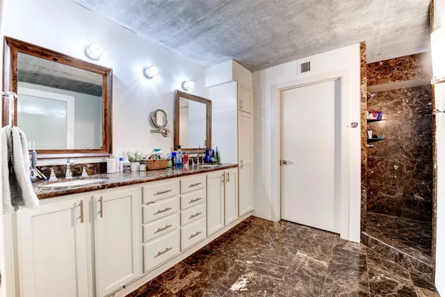 a bathroom with a bathtub and shower