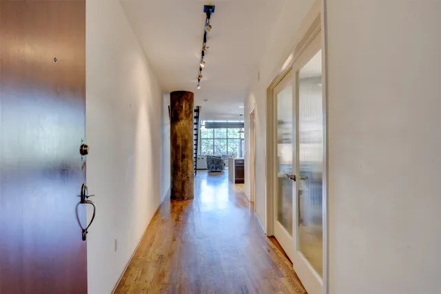 a bedroom with furniture and a chandelier