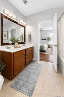 a en suite bathroom with a sink and a mirror