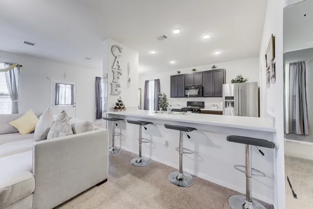 a spacious bathroom with a granite countertop sink and a mirror