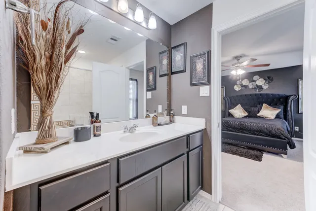 a view of walk in closet with clothes