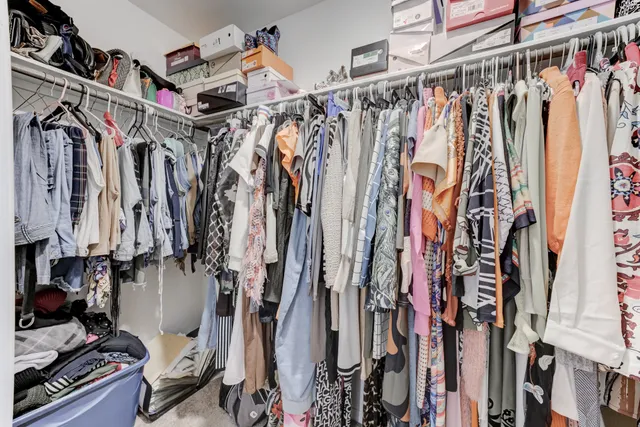 a bedroom with a bed and cabinets