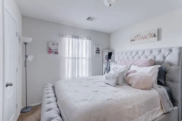a bathroom with a toilet a sink and a mirror