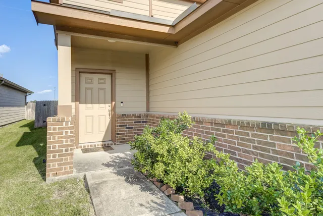 a view of entryway with white walls and stairs