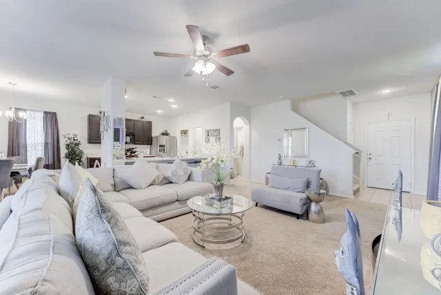 a kitchen with stainless steel appliances granite countertop a refrigerator stove and sink