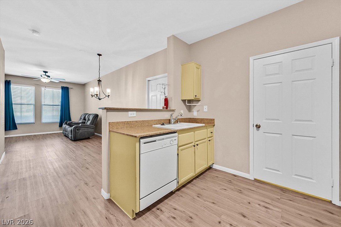 10550 West Alexander Road, Unit 1097 Las Vegas, NV 89129 - Photo 8 of 37 Seamless transition from the kitchen into the spacious open living & dining areas.