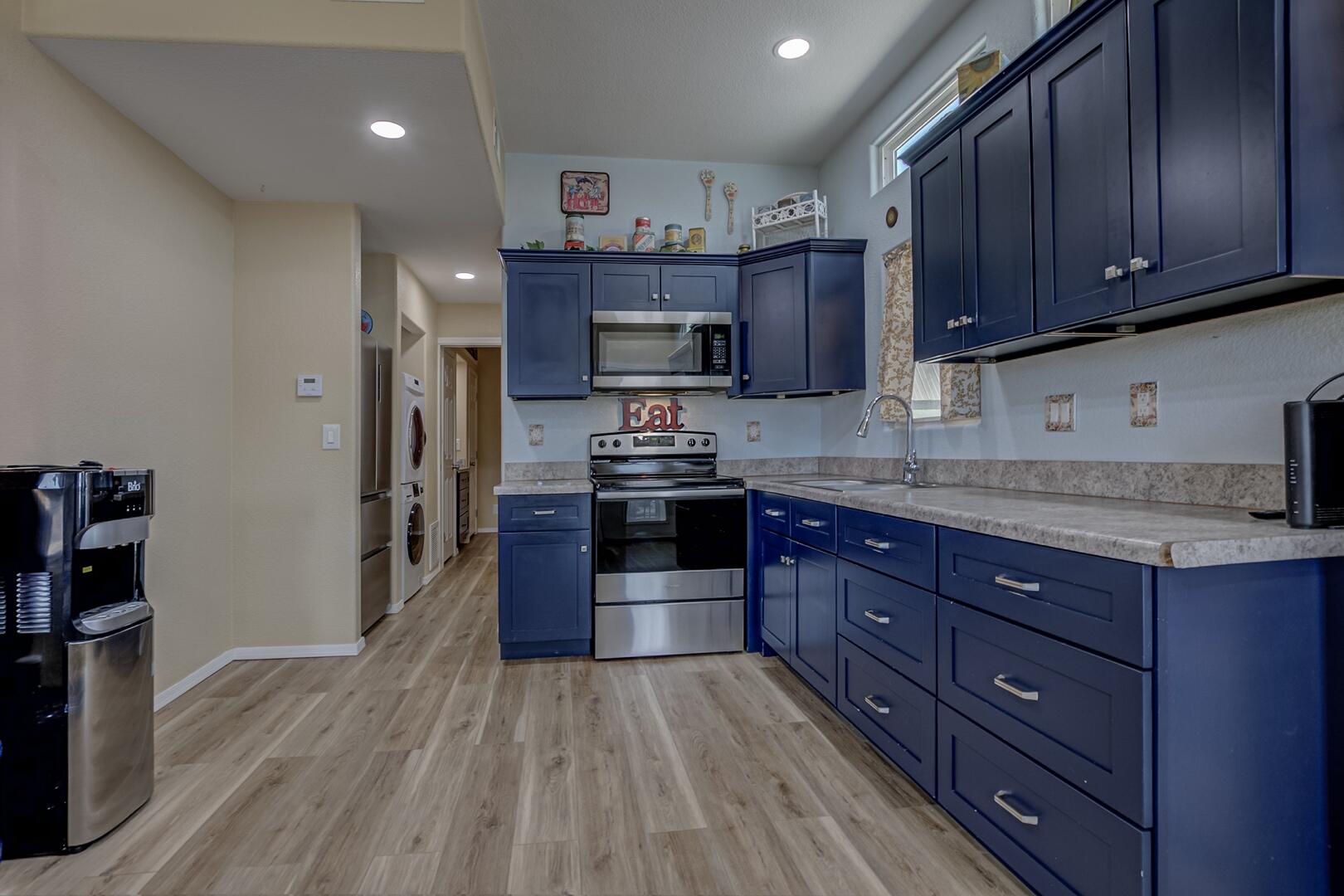 16 North Star Vale Road, Unit 122B Star Valley, AZ 85541 - Photo 9 of 21 a kitchen with stainless steel appliances granite countertop wooden cabinets and a stove top oven
