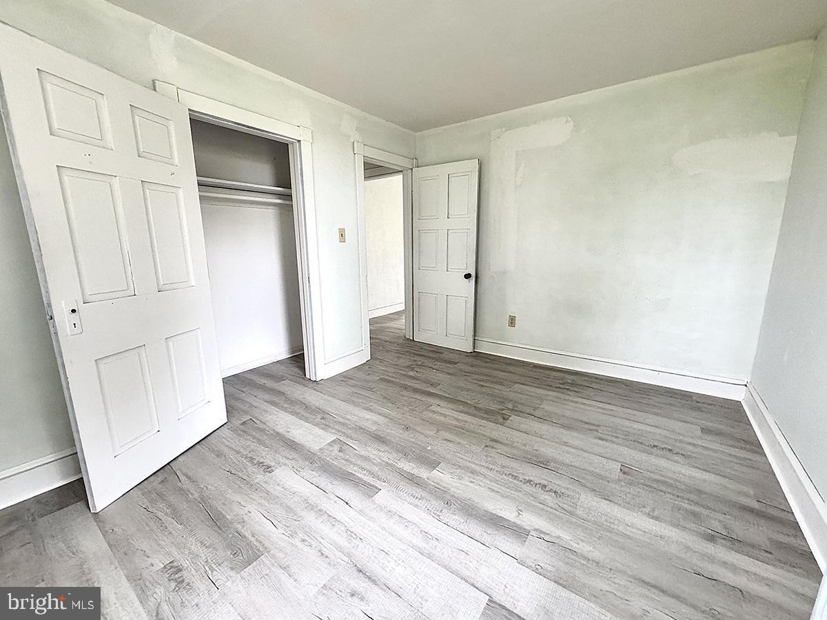 133 Hunter Road Oley, PA 19547 - Photo 21 of 44 a view of an empty room with wooden floor