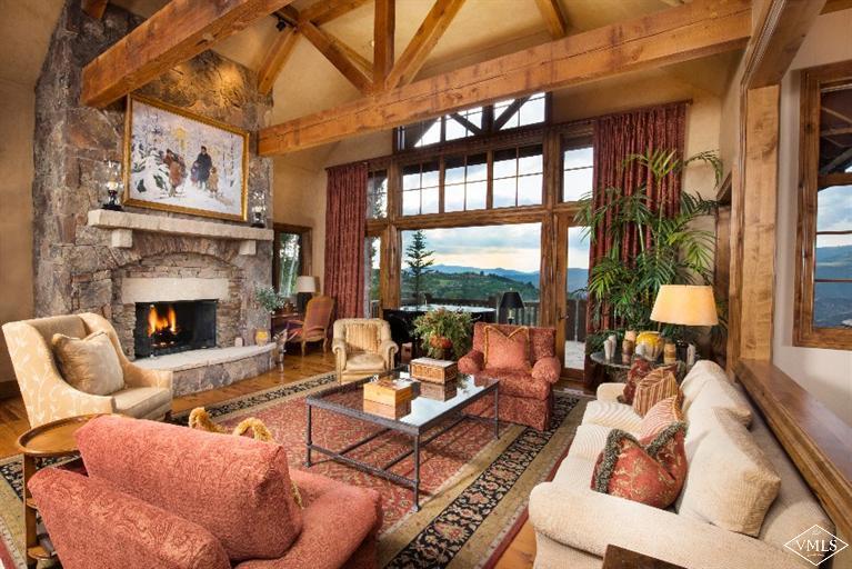 1101 Daybreak Ridge Road Avon, CO 81620 - Photo 2 of 10 a living room with furniture fireplace and a large window