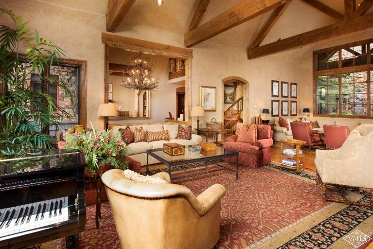 1101 Daybreak Ridge Road Avon, CO 81620 - Photo 3 of 10 a living room with fireplace furniture and a potted plant