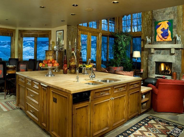 1101 Daybreak Ridge Road Avon, CO 81620 - Photo 4 of 10 a kitchen with stainless steel appliances granite countertop a stove and a sink