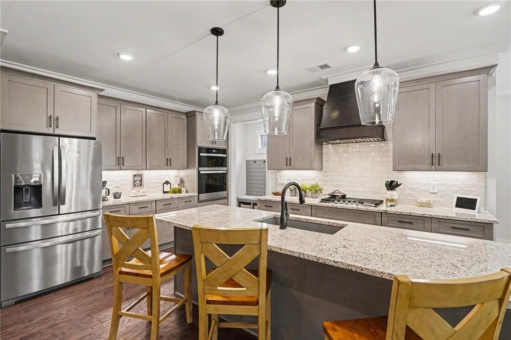287 Conner Lane Williamson, GA 30292 - Photo 13 of 33 a kitchen with stainless steel appliances granite countertop a sink a stove a refrigerator and island