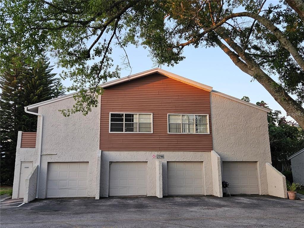 2796 Curry Ford Road, Unit B Orlando, FL 32806 - Photo 1 of 1 a front view of a house with a yard and garage