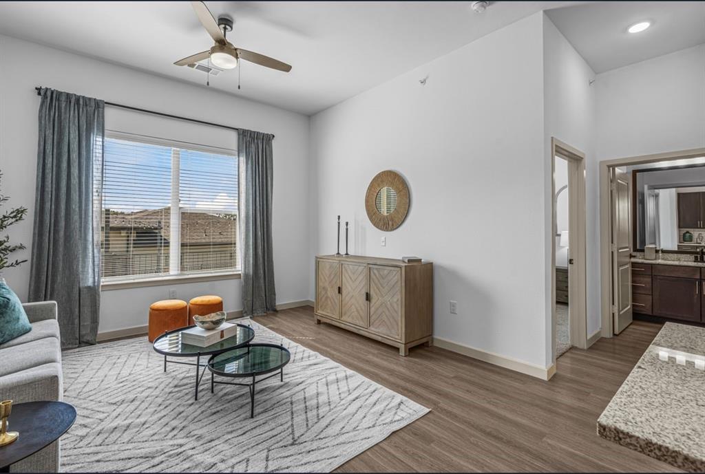3120 East Park Row Drive, Unit 4312 Arlington, TX 76010 - Photo 7 of 11 a living room with furniture and a window