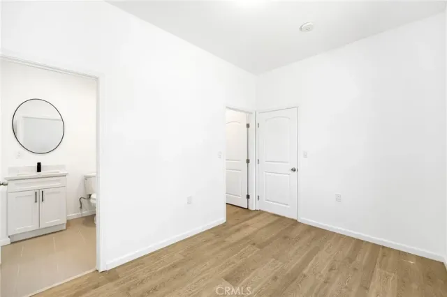 a view of a bathroom with dual sinks