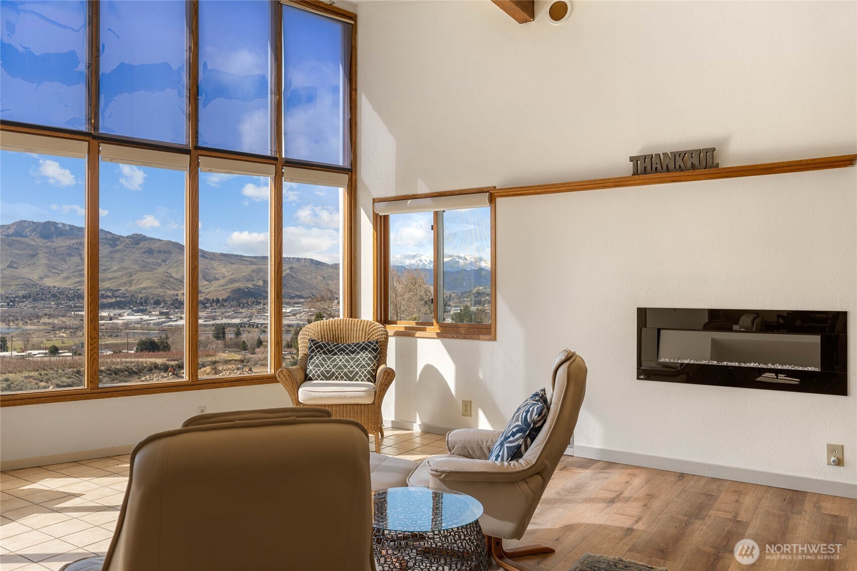 71 Blue Grade Road East Wenatchee, WA 98802 - Photo 8 of 29 a living room with furniture a flat screen tv and a large window