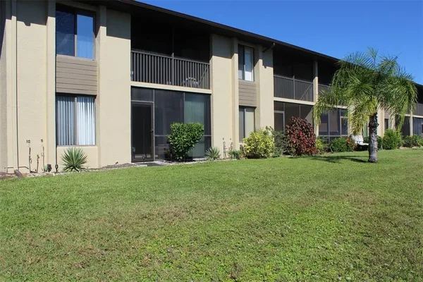 a view of lake with houses in the back